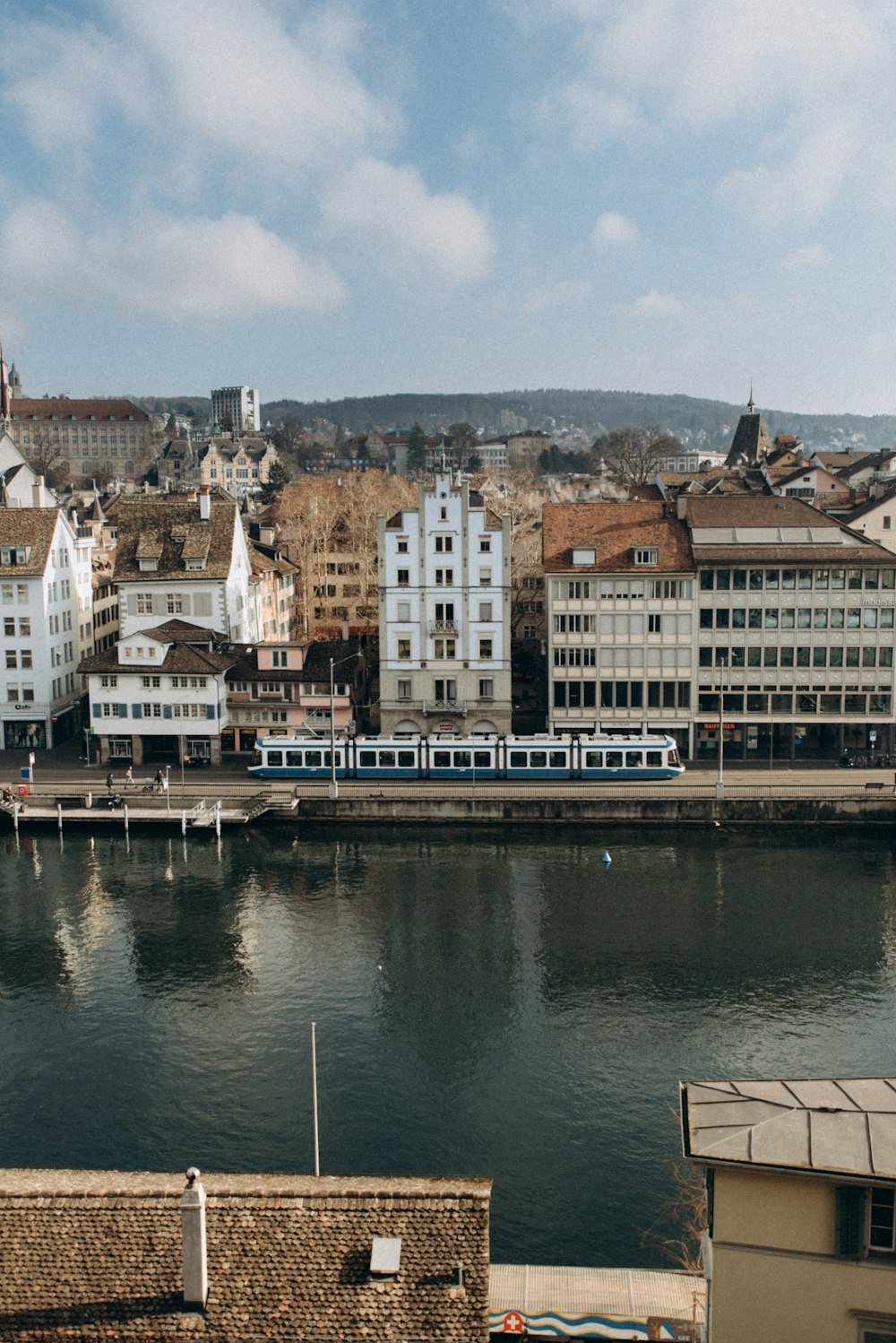 a river running through a city next to tall buildings