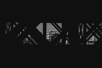 a black and white photo of a bridge