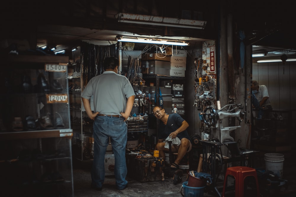 a man and a woman working in a shop