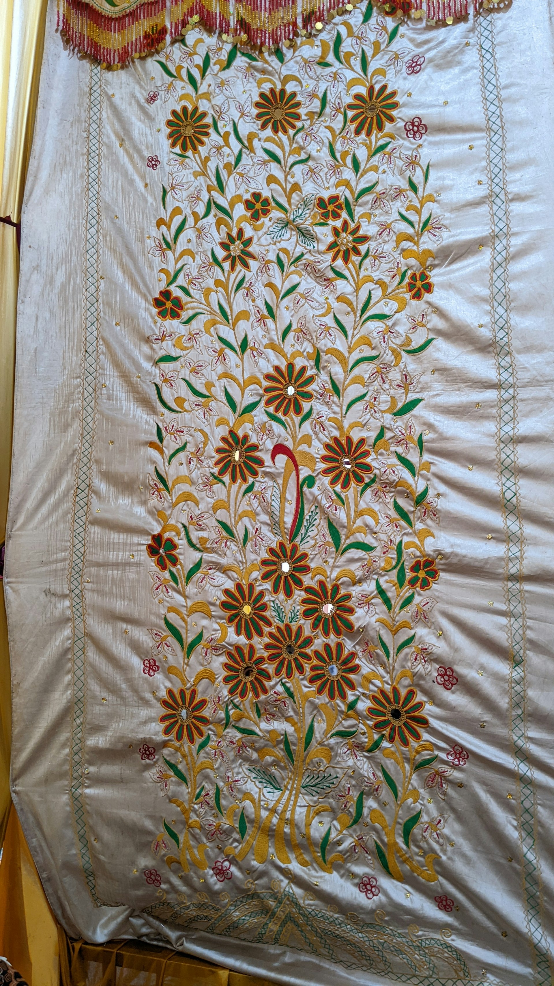 woman wearing yellow long-sleeved dress under white clouds and blue sky during daytime