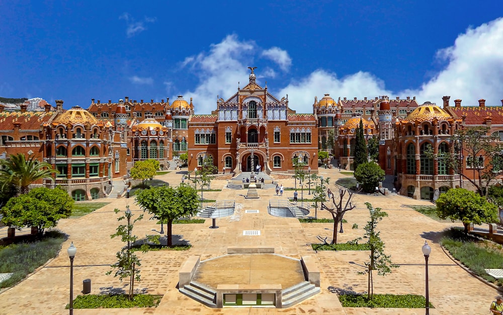 a large building with a fountain in front of it