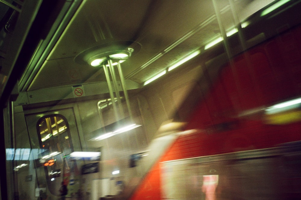 a blurry photo of a subway train at night