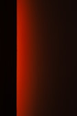 a black and white photo of a red light