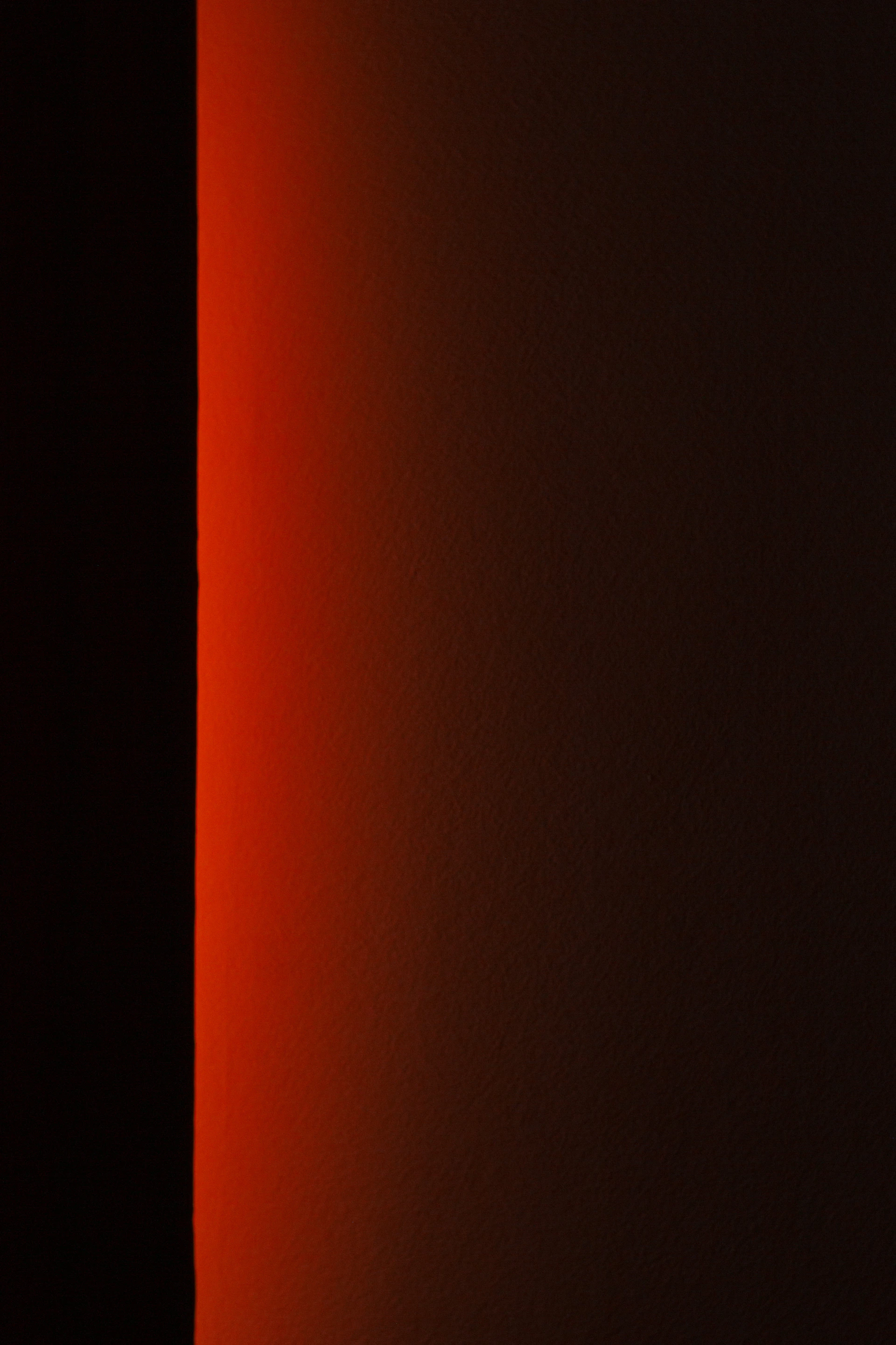 a black and white photo of a red light