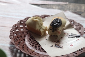 Smooth date paste spread on a piece of warm, freshly baked bread with a sprinkle of nuts.