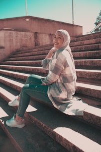 Farzaneh smiling warmly on a sunlit city street, capturing her lively and approachable spirit.