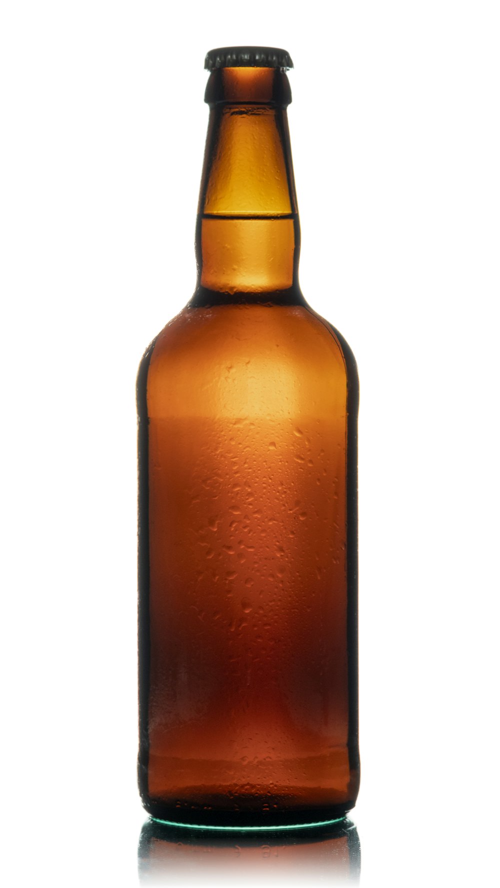 a brown glass bottle with water droplets on it