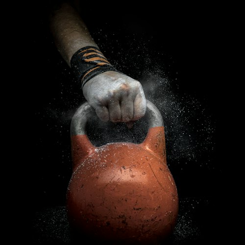 Close-up of hands wringing out a damp towel as a grip strength exercise