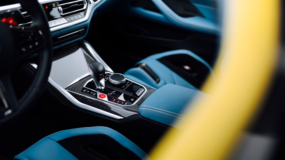 the interior of a car with a steering wheel and dashboard