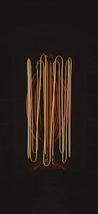 a black background with a bunch of orange lights