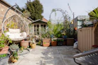 a back yard with lots of potted plants