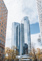 a couple of tall buildings sitting next to each other