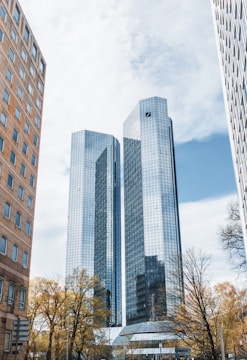 a couple of tall buildings sitting next to each other