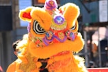 a person in a yellow dragon costume