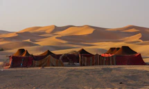 a group of tents set up in the desert