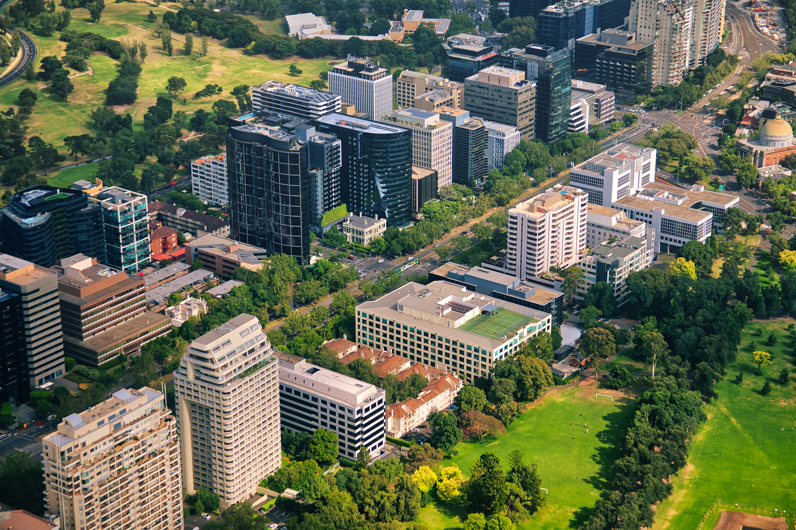 Aerial view of leafy inner Melbourne — buildings, streets and parkland