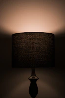 An elegant 3D-printed lamp casting soft shadows in a cozy corner of a modern living room