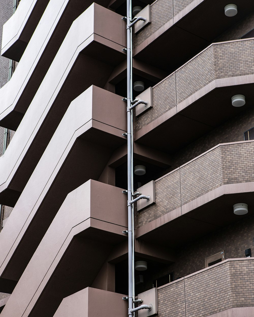 a tall building with balconies on the side of it