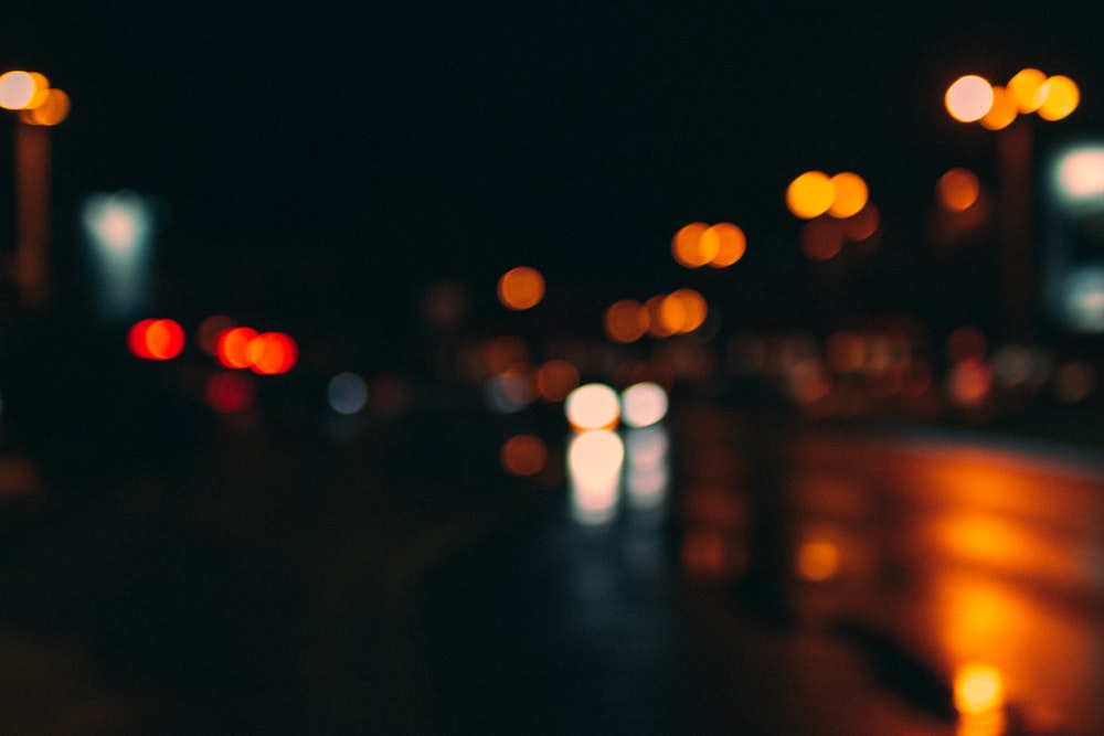 a blurry photo of a city street at night