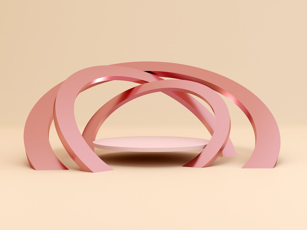 a pink sculpture sitting on top of a table