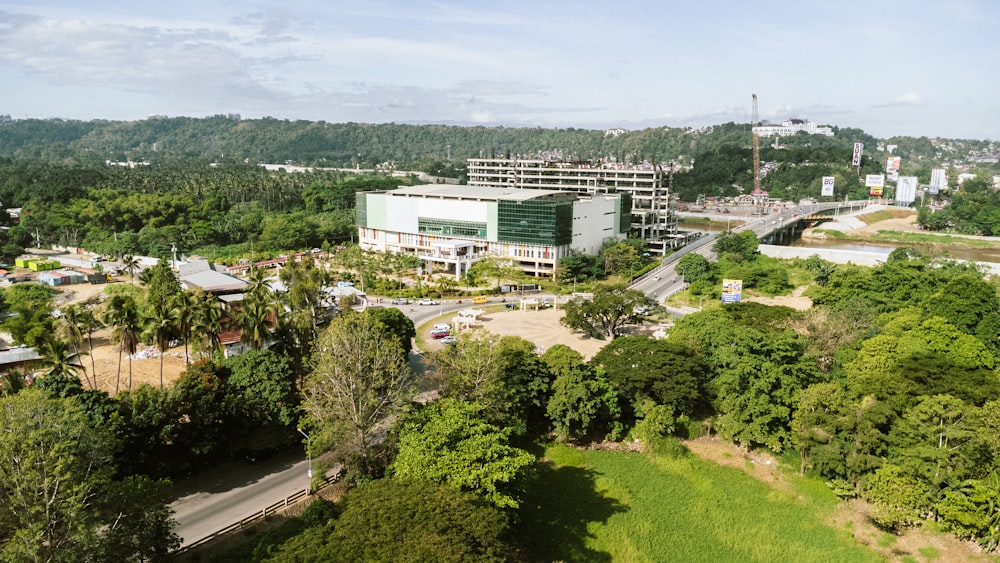 an aerial view of a large building surrounded by trees