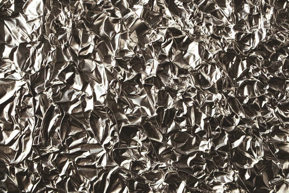 a black and white photo of a metal sheet