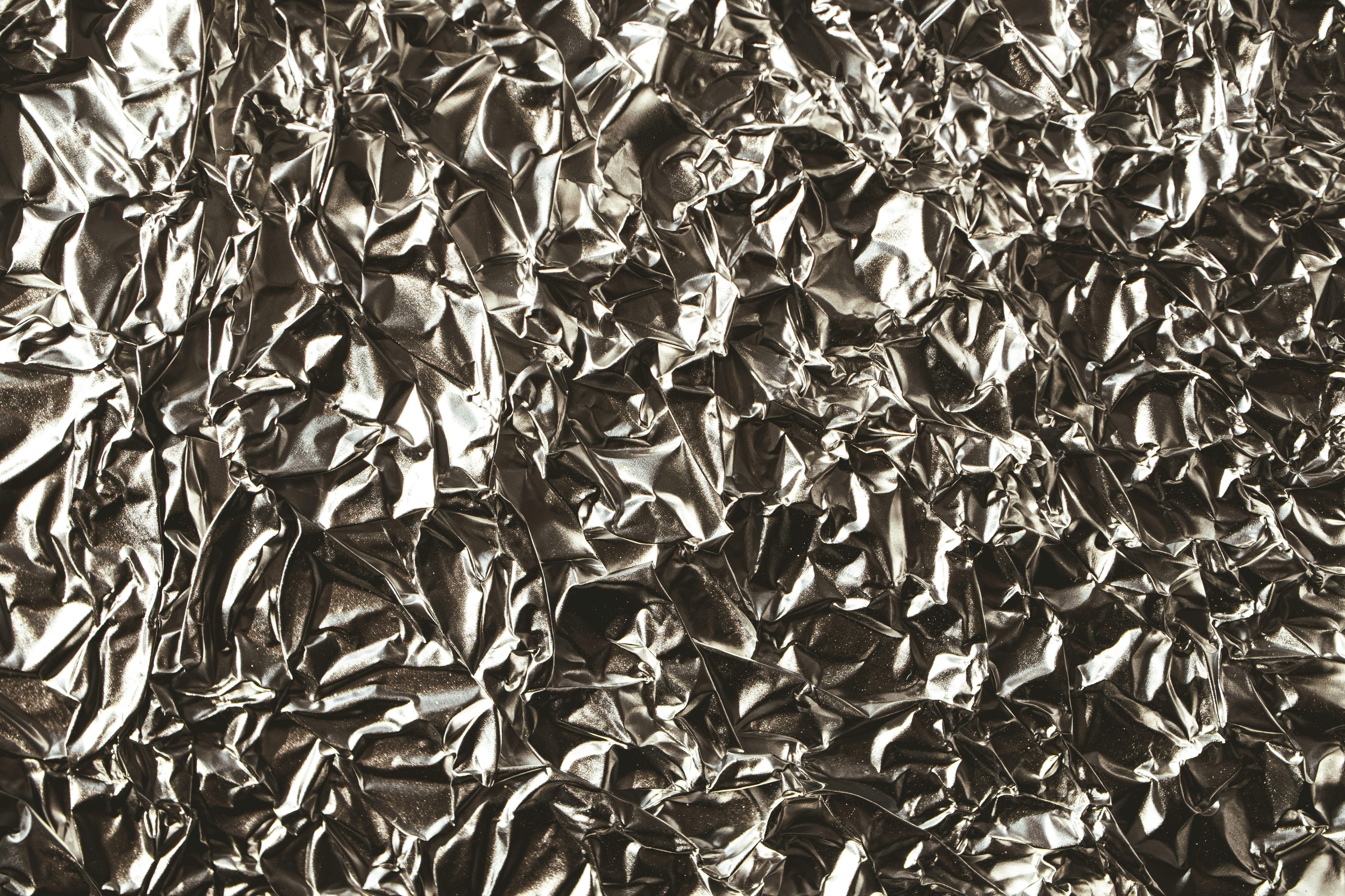 a black and white photo of a metal sheet