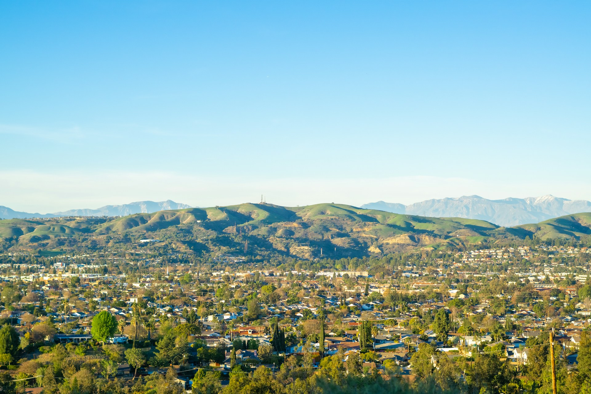 a view of a city with mountains in the background
