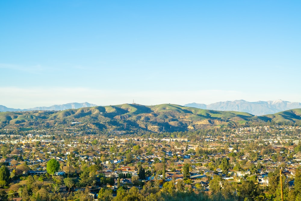 a view of a city with mountains in the background