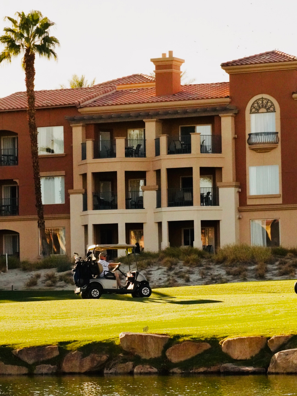 a golf cart parked in front of a hotel