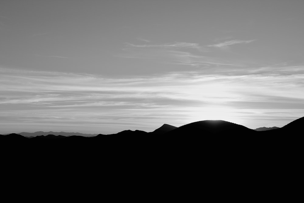 a black and white photo of a mountain range