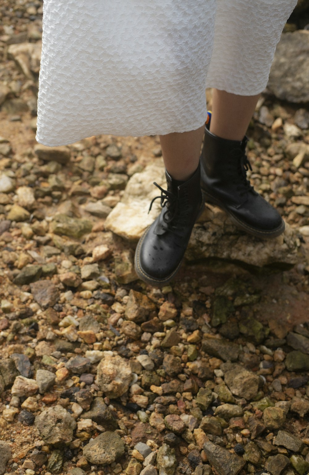 a close up of a person wearing black shoes