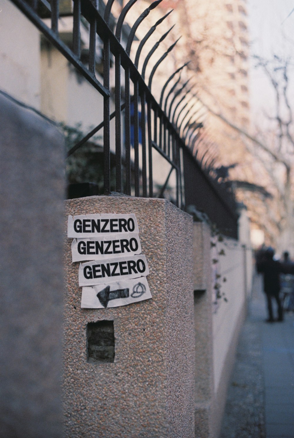 a sign on the side of a building that says genzero genzero