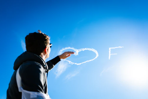 a man is flying a kite in the sky