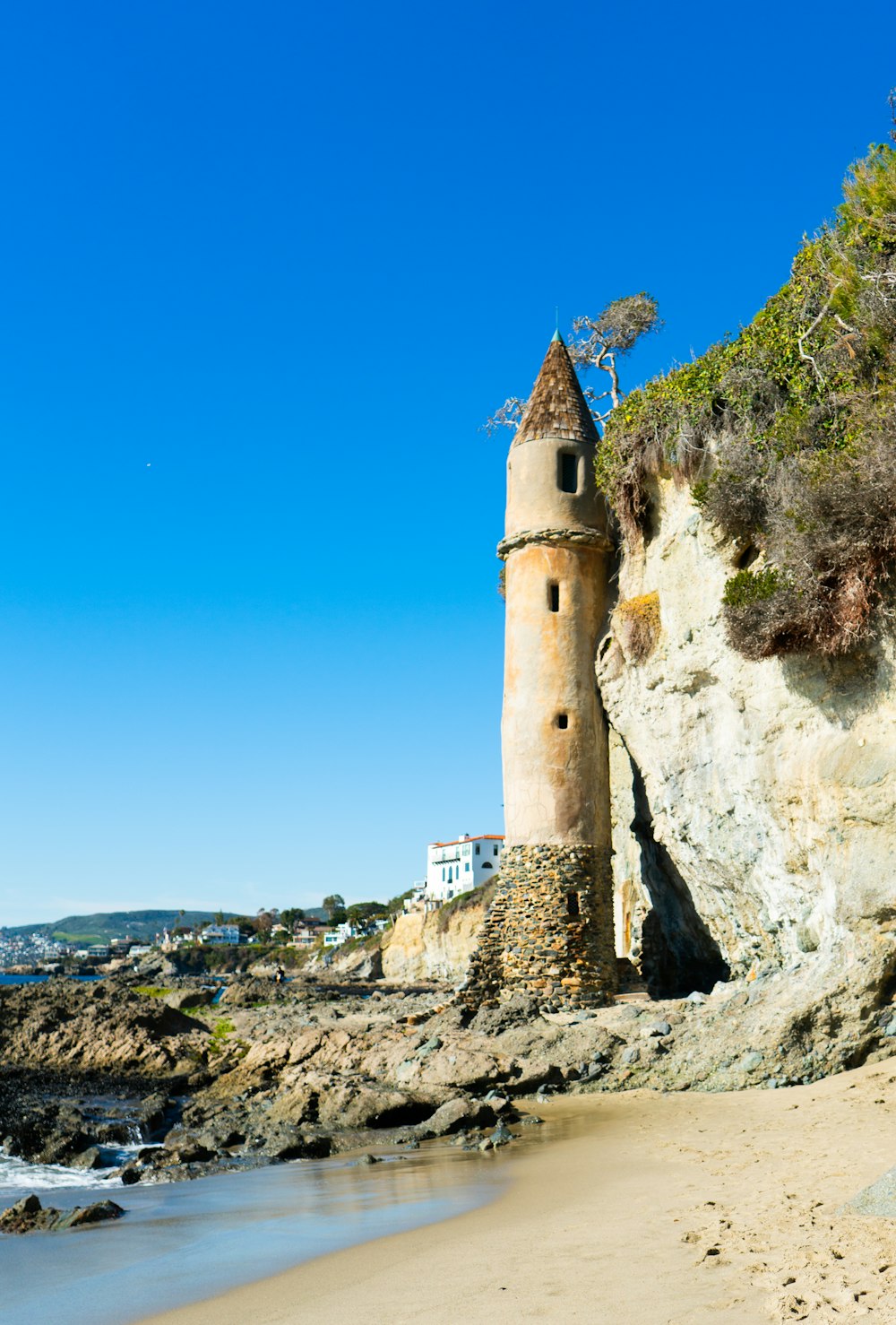 a tower that is on the side of a cliff