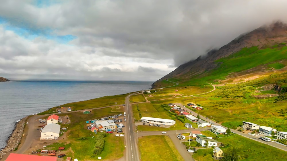 an aerial view of a small town by the ocean