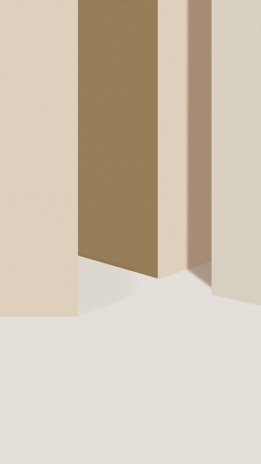 Vertical rectangular shapes with soft pastel coloring, creating a minimalist and abstract effect. The shapes seem to cast shadows on a light background, giving a sense of depth.