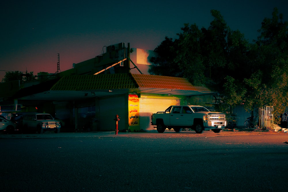 a truck is parked in front of a house