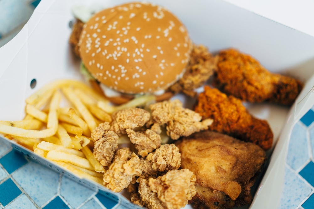 a box filled with different types of food on a plate