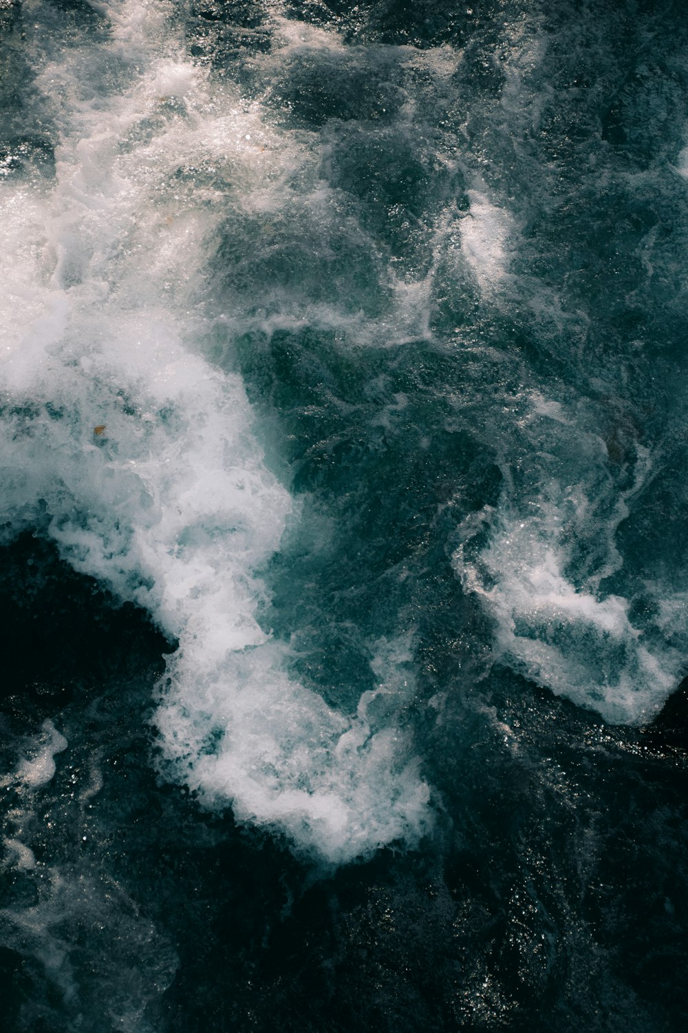 a large body of water surrounded by waves