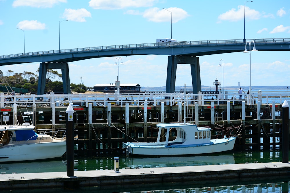 a couple of boats that are sitting in the water