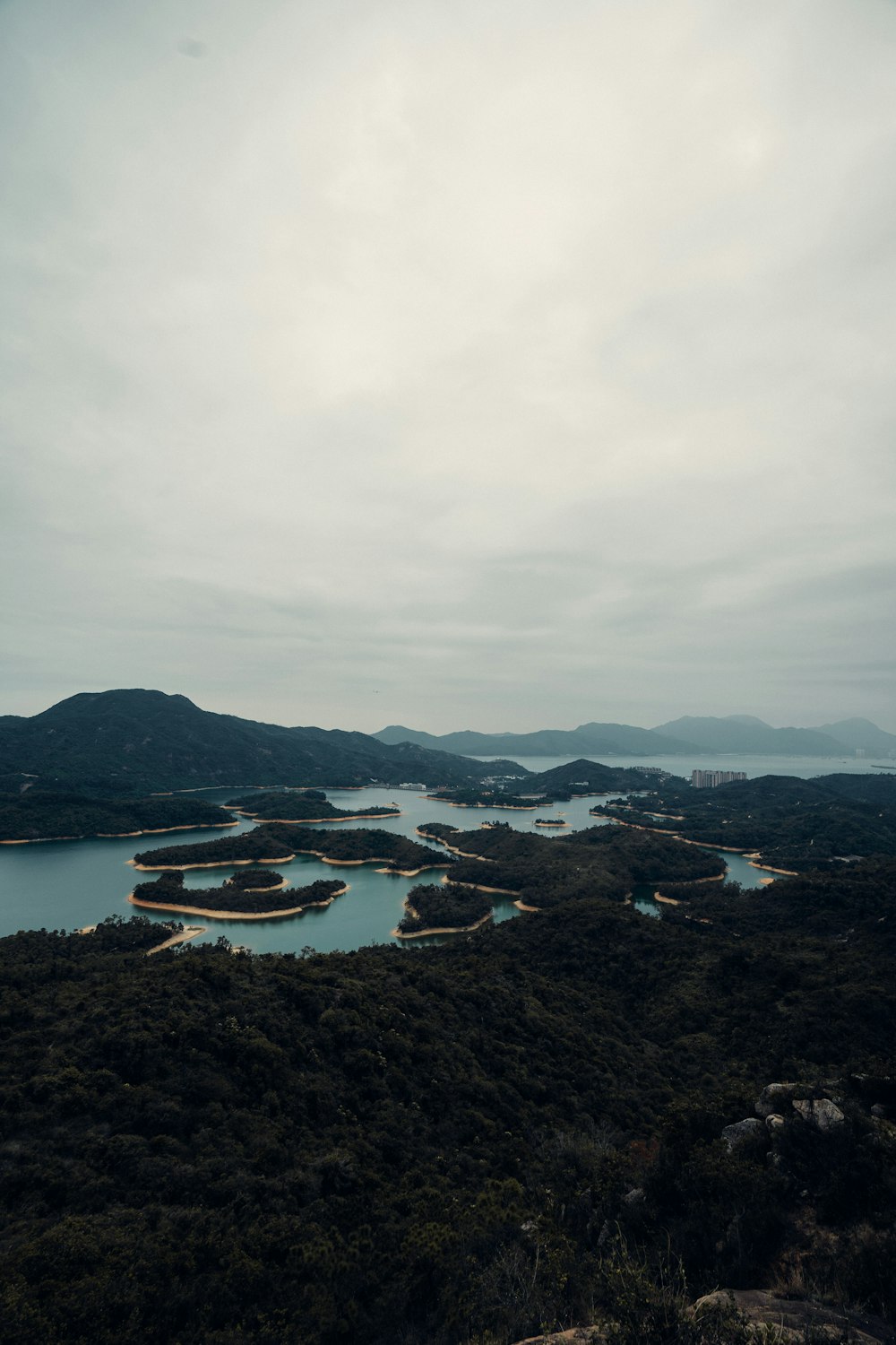 a body of water with a mountain in the background