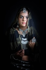 a woman in a black and gold outfit
