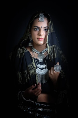 a woman in a black and gold outfit