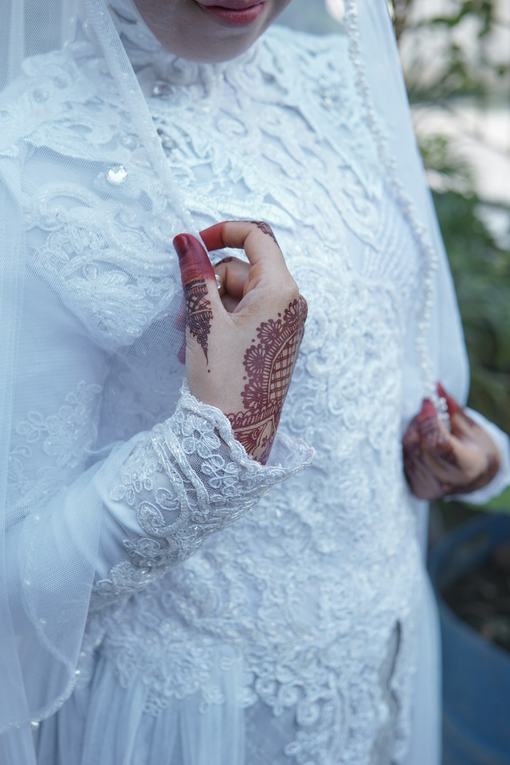 a woman in a white dress holding a red object