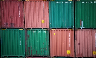 a stack of green and red containers sitting on top of each other