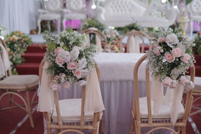 a couple of chairs that have flowers on them