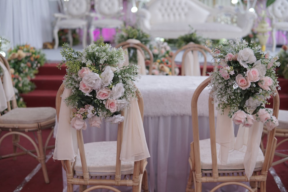 a couple of chairs that have flowers on them