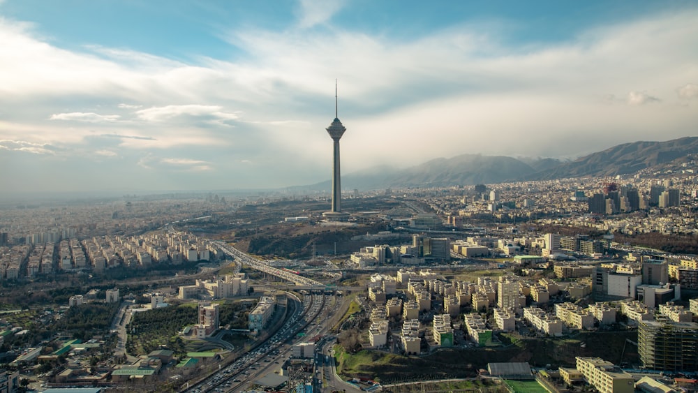 an aerial view of a city with tall buildings