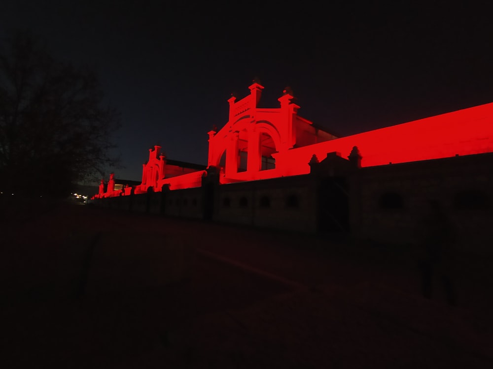 a building with a red light on the side of it